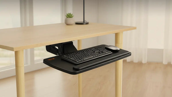 FlexArc 25-inch adjustable under-desk keyboard tray with a keyboard and mouse beneath a light wood desk