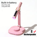 Pink rechargeable nail lamp on stand with 30- and 60-second instructions