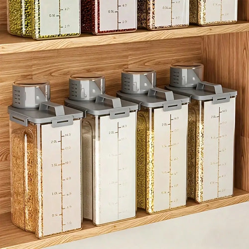 Four clear dry food storage containers with white trim displayed on a pantry shelf