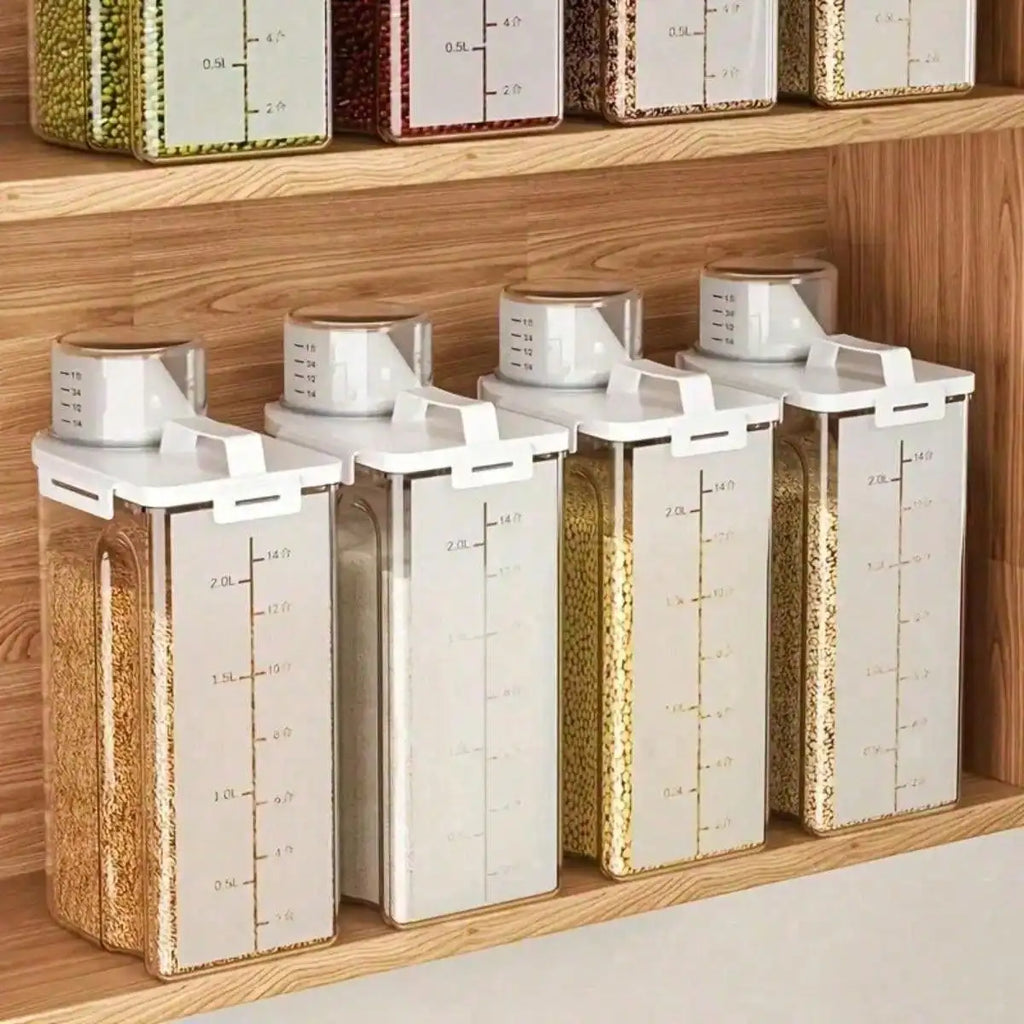 Four matching clear pantry containers with marked bodies and cup-style spout covers