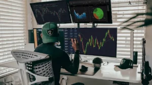 A crypto trader analyzing blockchain data and market trends using multiple monitors. Zynqle provides expert analysis on cryptocurrency platforms like Crypto30x.com.