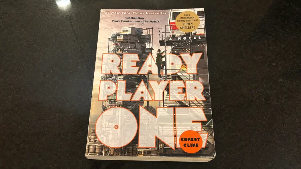 Ready Player One paperback book placed on a dark desk for a review article